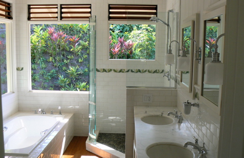 His and Hers sinks, glass shower, a full-size soaking tub with views of the jungled hillside and lots of natural light and ventilation make this Master bath a pleasure.
