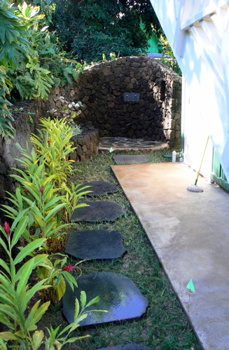 One of two outdoor showers incorporated into the retaining wall. This shower is for the guest cottage above the garage.