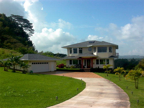 expansive lawn and curving drive greet visitors to the Brown home.